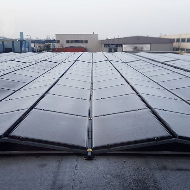 The back view of our new office.. #solarpanels #freakingcold
